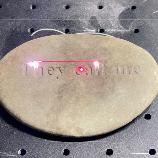 tans tone being engraved with "they call me" by laser engraver, video
