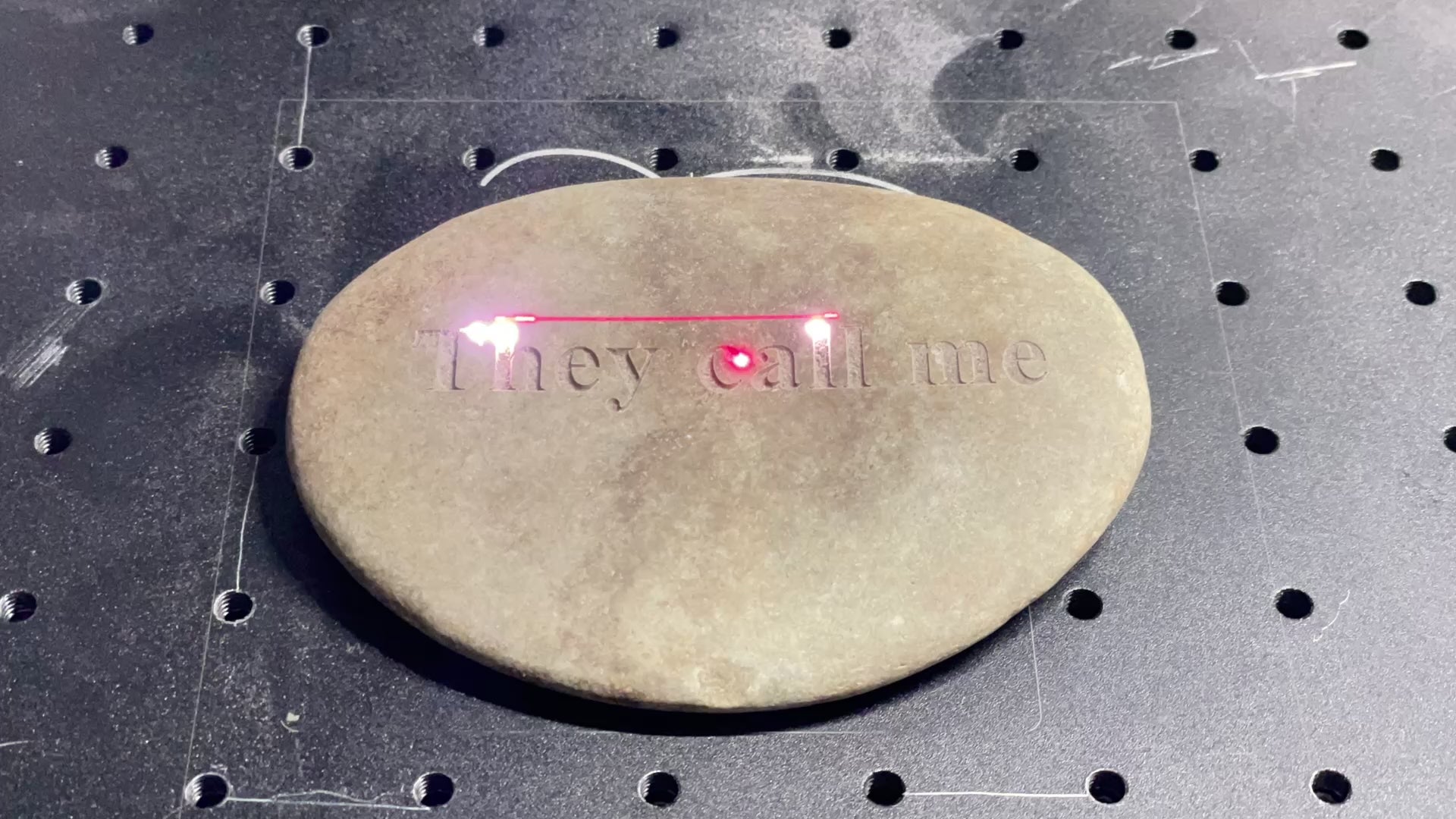 tans tone being engraved with "they call me" by laser engraver, video