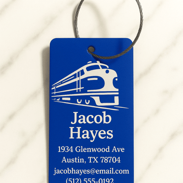 Personalized Custom Engraved Metal Luggage Tag in blue features a white train graphic above “Jacob Hayes”, with his Austin, TX address, email (jacobhayes@email.com), and phone ((512) 555-0192) below—all in white text. Includes chain choice.