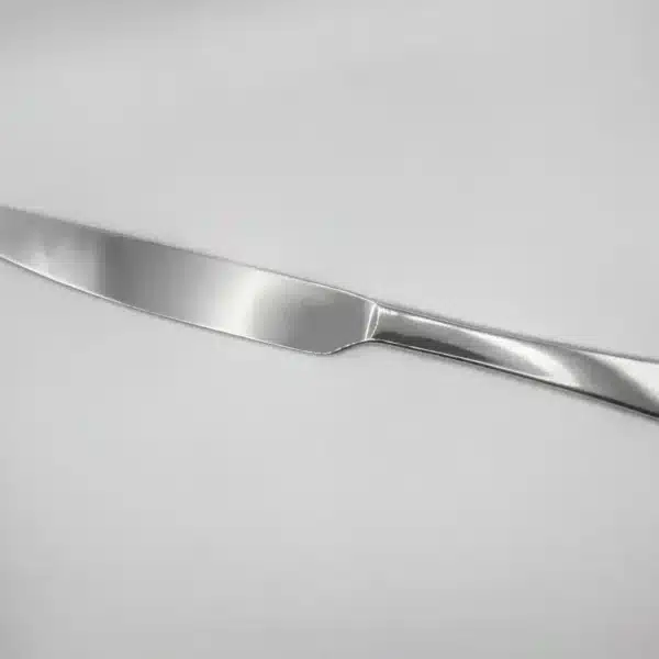 A Premium 9.5 Inch Personalized Butter Knife made of stainless steel is placed on a white surface and photographed from above.