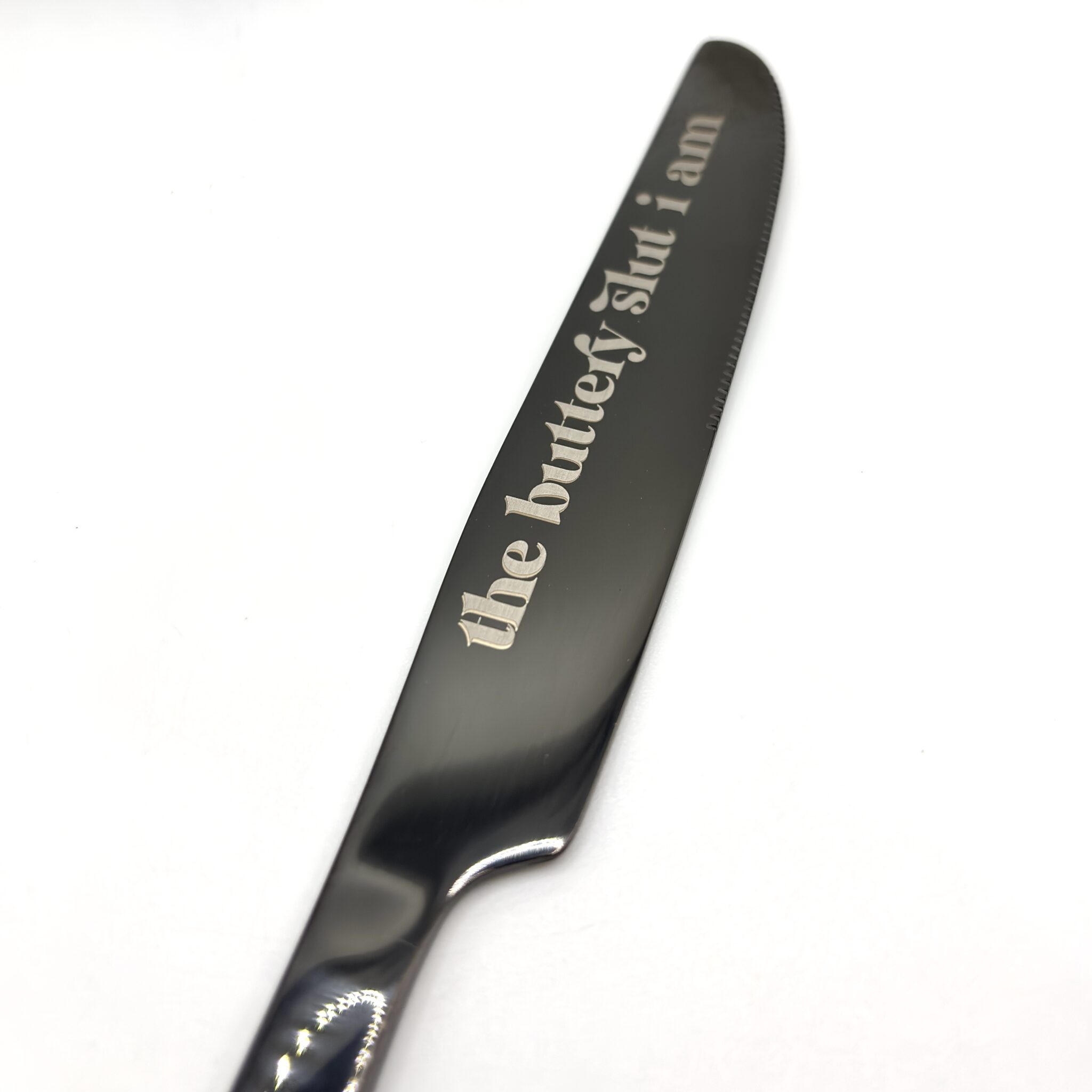 A 9" Custom Engraved Black Knife featuring the text "the buttery slut i am" on its blade, displayed on a plain white background.