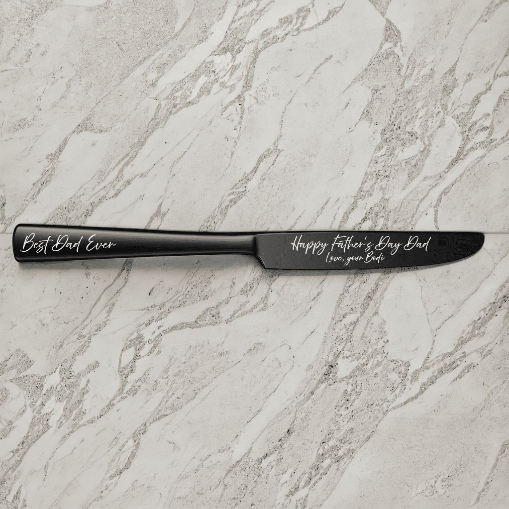 A 9" Custom Engraved Black Knife on a marble surface, featuring "Best Dad Ever" on the handle and "Happy Fathers Day Dad, Love your Bride" in white script on the blade.