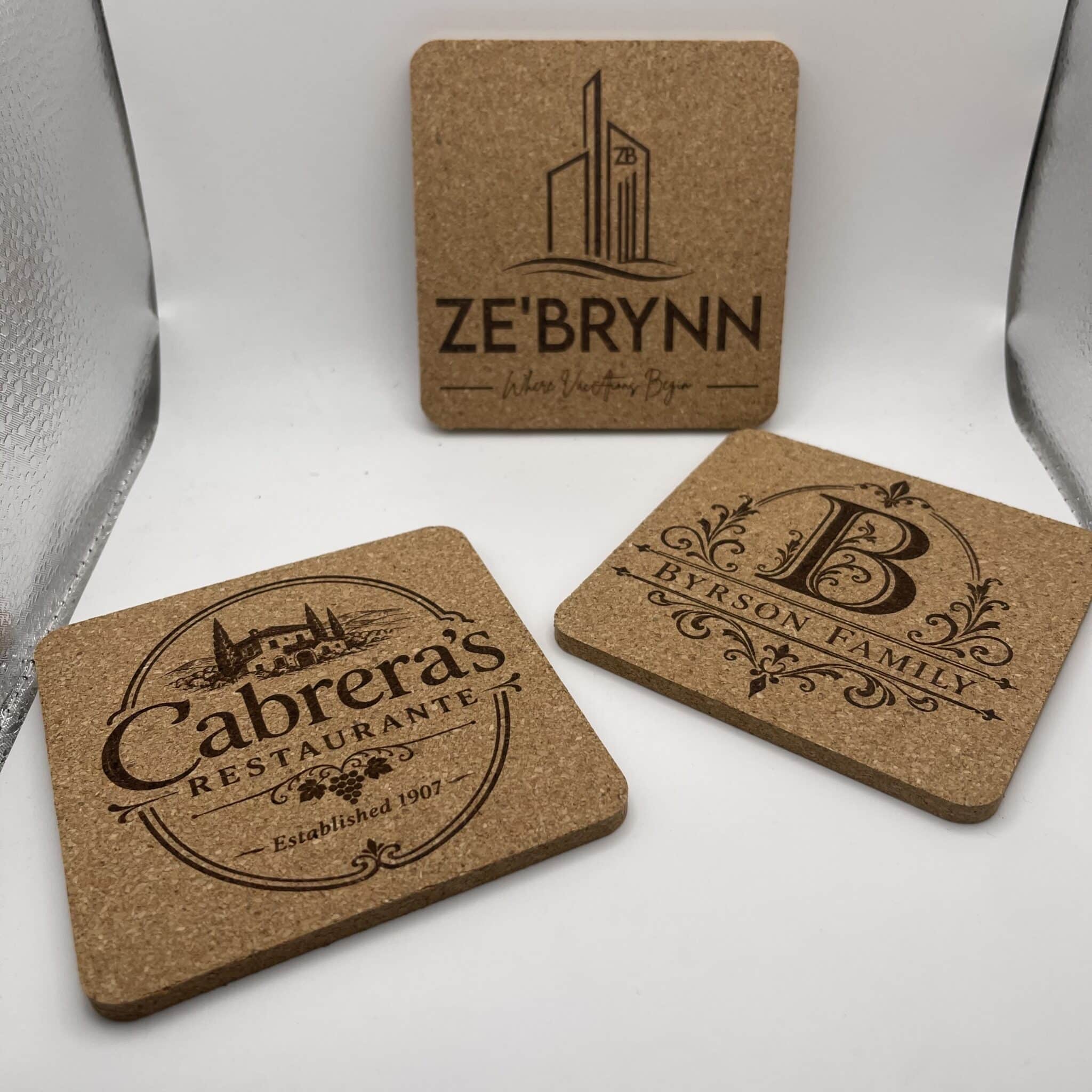 Close-up of a cork coaster featuring a black city skyline logo and the wordmark of a restaurant in dark ink.